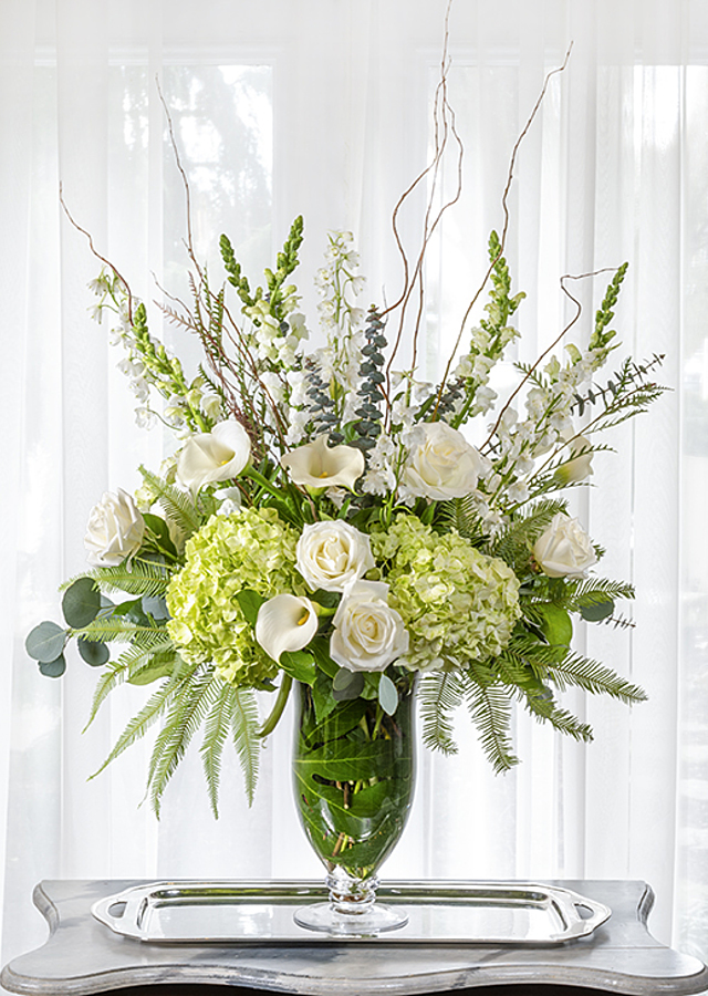 Pre-arranged flowers in vases are the perfect hostess gift solution